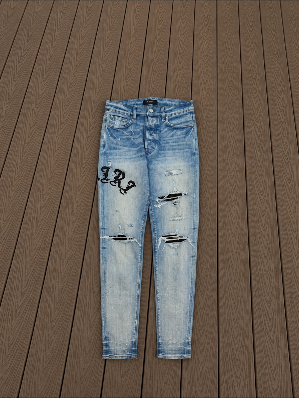 AMIRI Light Blue Distressed Skinny Jeans with Black Script